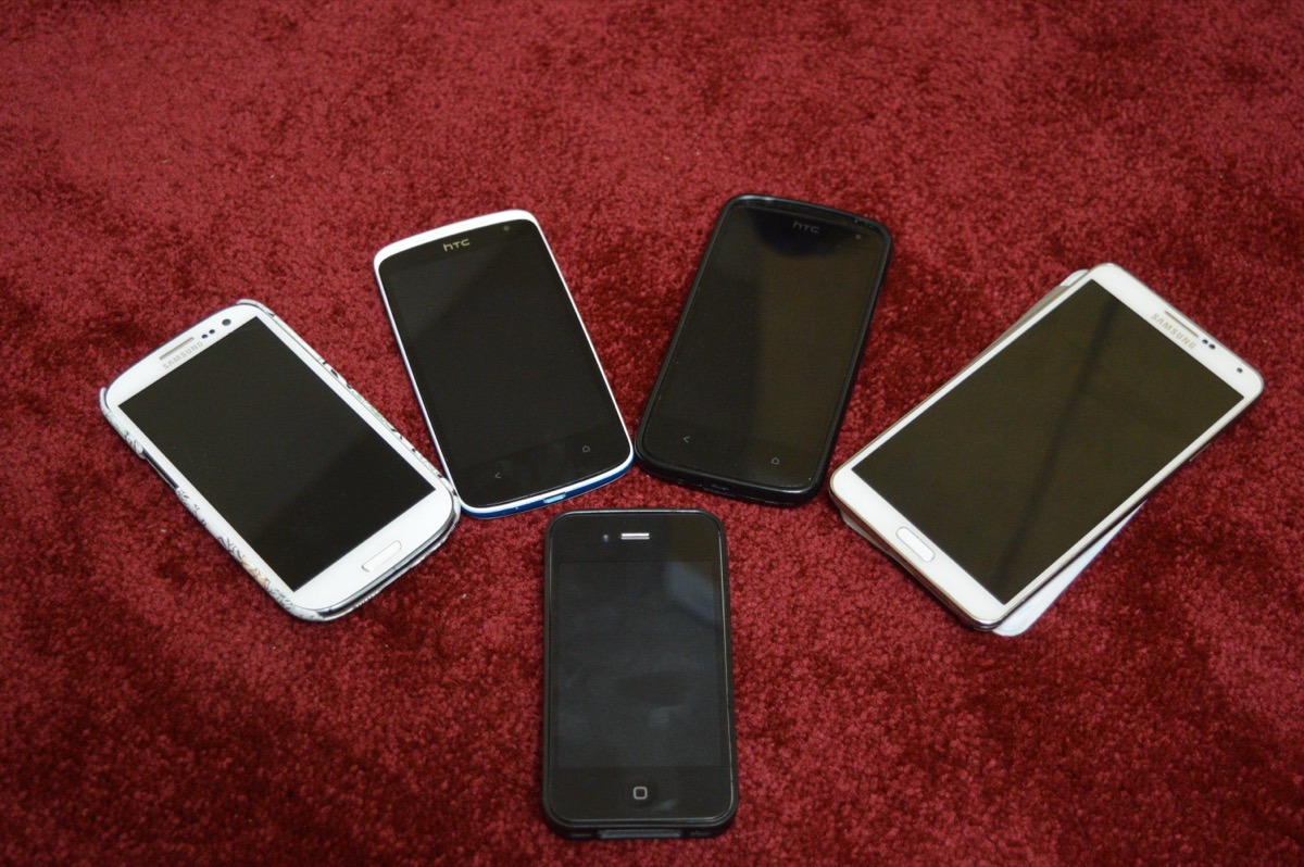 Five different smartphones side by side showing variation between device models